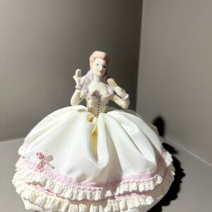 Elegant Ceramic Figurine with Pink and Cream Accents